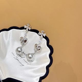 Boucles d'oreilles pendantes cœur de perles